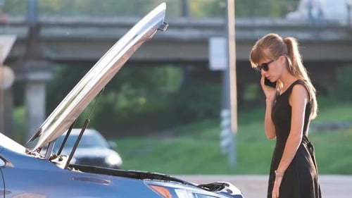 Helpless Woman Standing Near Her Car with Open Bonnet Calling Road Service for Help