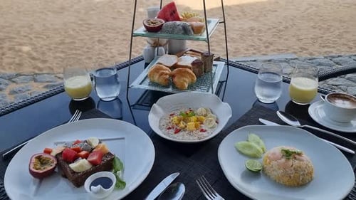Breakfast on the Beach in Thailand a Luxury Breakfast Table with Food and Beautiful Tropical Sea