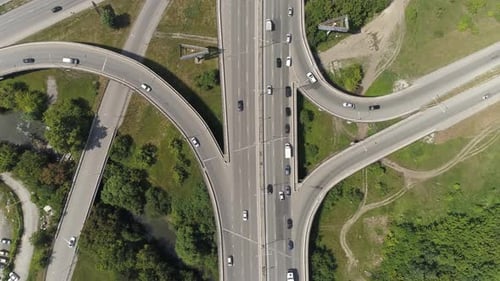 Top down aerial view of Road junction with car traffic in a city. 07