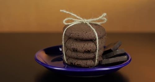 Stacked Cookies with Chocolate on a Plate
