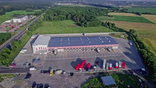 Buildings of Logistics Center Warehouses Near the Highway