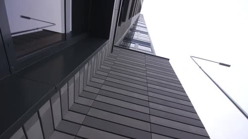 Facade of Office Building with Tiles and Windows in City