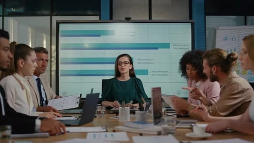 Diverse Team Collaborates and Celebrates Success in Office