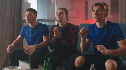 Friends Cheering and Celebrating While Watching Sports