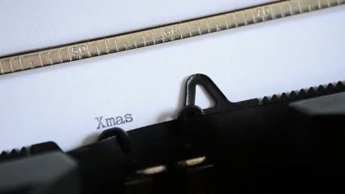 Typewriter Types "Xmas Time" Close Up Shot