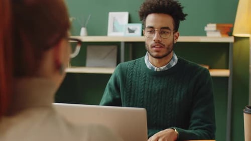 Male HR Manager Interviewing Female Candidate in Office