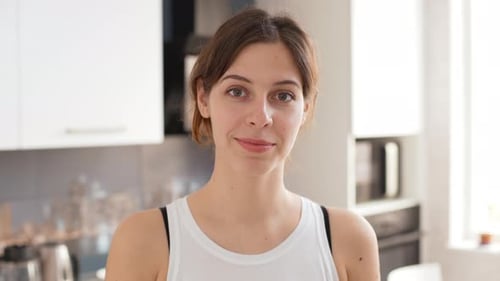 Young Woman Smiling Portrait in Home Kitchen
