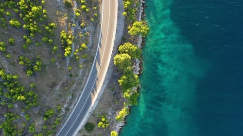 View of the road along the coast from the drone. Travel by car in summer time.