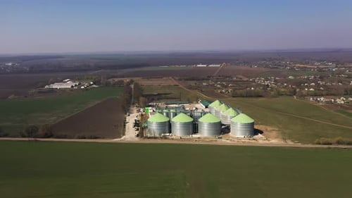 Aerial View of Grain Silos in Rural Landscape