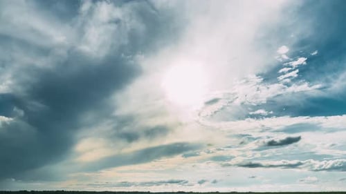 Dramatic Sky Before Rain With Rain Clouds On Horizon Above Rural Landscape Field Meadow