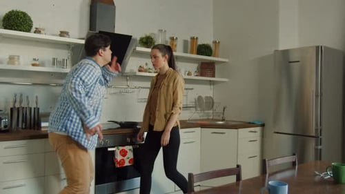 Man Yelling at Woman Covering Her Face