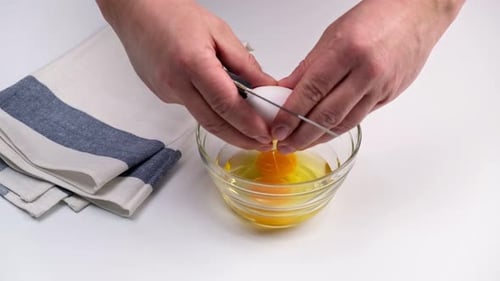 Cracking Three Eggs into Bowl for Cooking