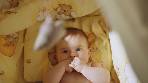 Beautiful Close Up Footage of a Cute Newborn Baby Lying on the Back in Child