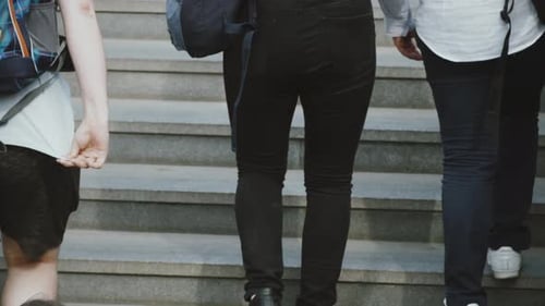People Climb the Stairs in The City
