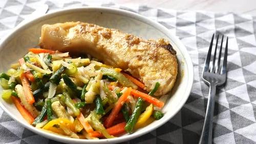 Fish Fillet and Vegetable on Plate Close Up.