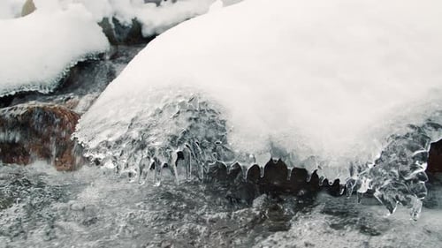 Winter River Background With Transparent Icicle Sheet On Powder Rocks