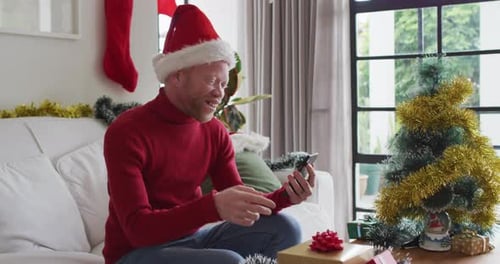 Joyful Adult Celebrates Christmas via Video Call