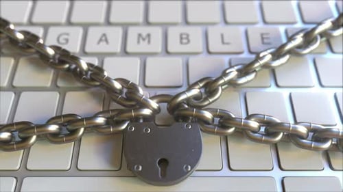 Padlock with Chains on the Keyboard with GAMBLE Text on Keys