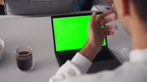 Person Using Video Conferencing Technology From Home for Video Call Green Screen