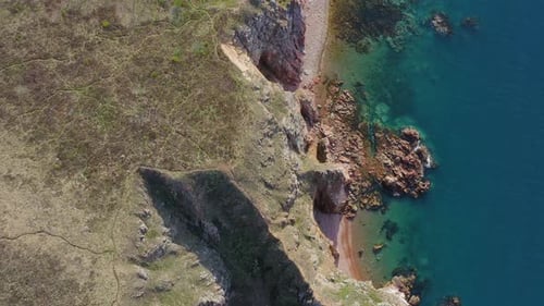 Rocky Beach on the Sea Coast with Clear Water and Beautiful Vertical Rocks