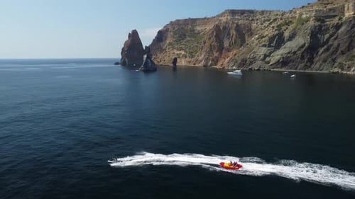 Jet Ski Pulling Raft at Beautiful Coastline