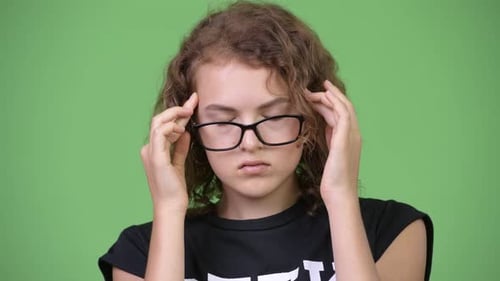 Teen Massaging Temples Close Up Studio Shot