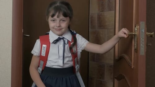 Coming Home From School. Pupil with a Satchel.