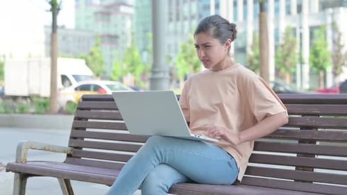 Indian Woman Having Back Pain While Using Laptop in Office
