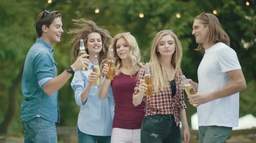 Party. Happy Friends Dancing And Drinking Outdoors.