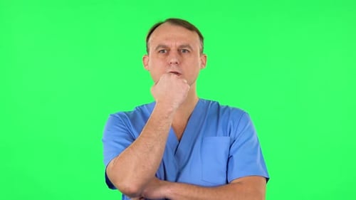 Medical Man Thinks About Something. Green Screen