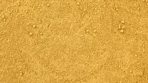 Textured Mustard Yellow Granular Abstract Background