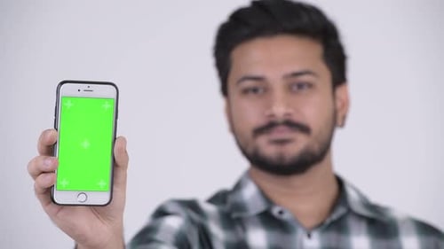 Young Adult Holding Phone with Green Screen