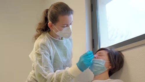 Medical Nurse in Gloves and Mask Test for Suspected Coronavirus Diagnosis