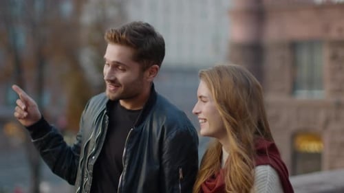 Romantic Couple Dating Outdoors. Beautiful Man and Woman Walking on City Street