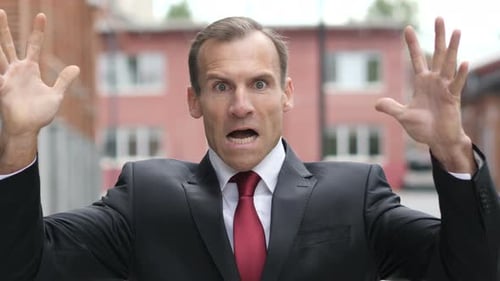 Man in Suit Reacts with Surprise and Yelling