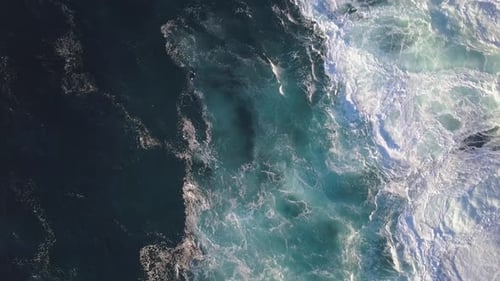 Aerial View of Turquoise Ocean Waves Crashing on Coast