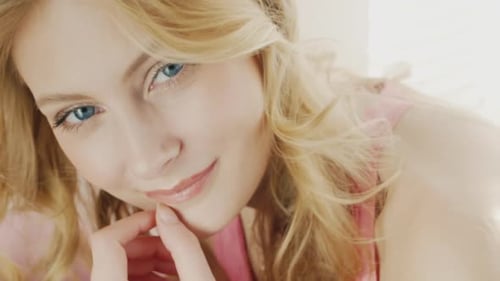 Smiling Blonde Woman Looking at Camera Close-Up