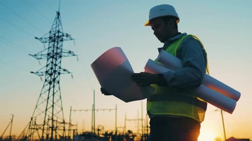 Architect Worker Checking Construction Project On Electric Tower