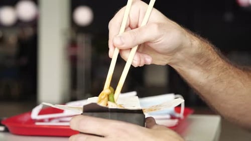 Man eating vegetarian noodles