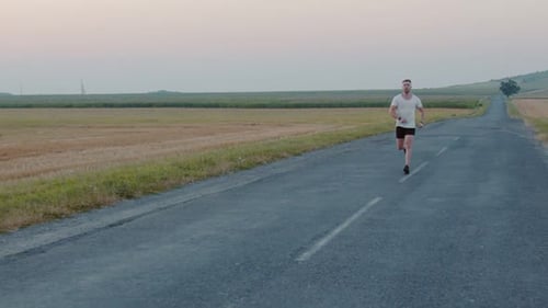 Handsome Athlete Doing Regular Exercises on Nature