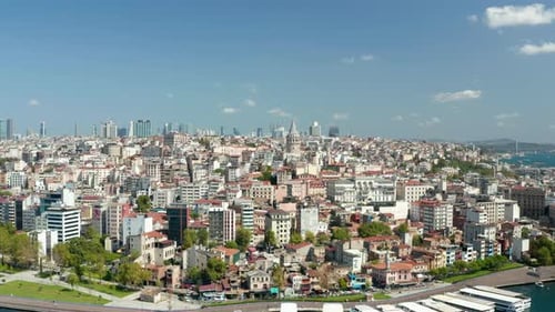 Beyoglu, Istanbul Establishing Shot with Beautiful Clear Blue Sky and Galata Tower on Bosphorus