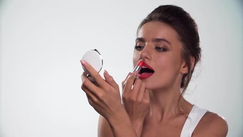 Woman Applying Red Lipstick, Fashion and Beauty