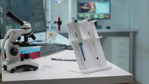 Close-up of Microscope and Test Tubes in Laboratory