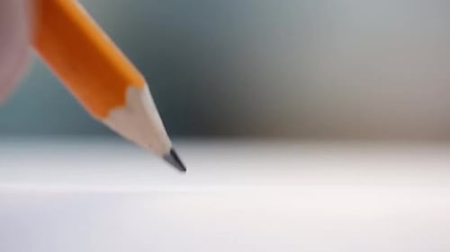 Draw A Drawing On A White Sheet With A Pencil. Very Close