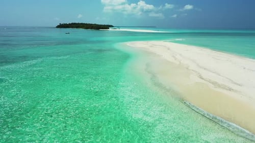 Aerial drone seascape of exotic shore beach break by blue ocean and white sand background of a daytr