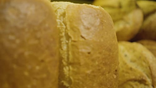 Camera Moving Along Shelf with Fresh Baked Bread. Close-up of Delicious Bakery Lying in Grocery for