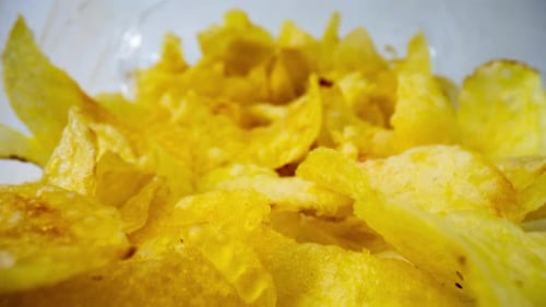 Macro Fly-through Footage of Potato Chips in Packet
