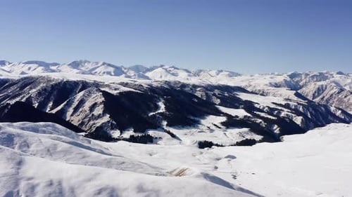 Aerial View of Snow Covered Mountain Range