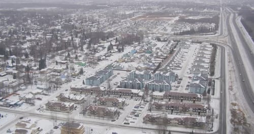 Helicopter aerial over industrial San Fransisco coast, tracking forward, day