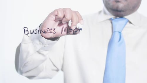 Writing Business Meeting on Clear Surface